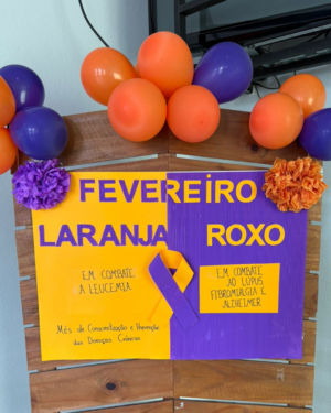 ALUNAS DE ENFERMAGEM DO UNIFOR-MG PROMOVEM AÇÃO DE SAÚDE NA UBS SOUZA E SILVA EM ALUSÃO AO FEVEREIRO ROXO E LARANJA